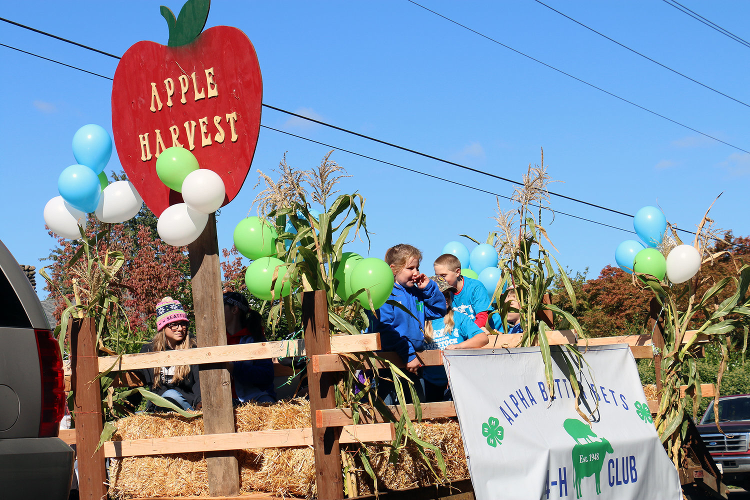 In this Oct. 3, 2015 file photo, members of the Alpha Better Bets 4-H Club ride a float during the parade at the seventh annual Apple Harvest Festival in Onalaska on Saturday.